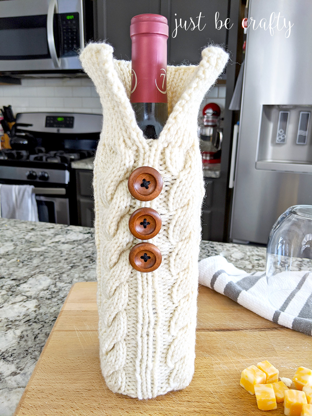 knitted wine bottle sweater on a kitchen counter