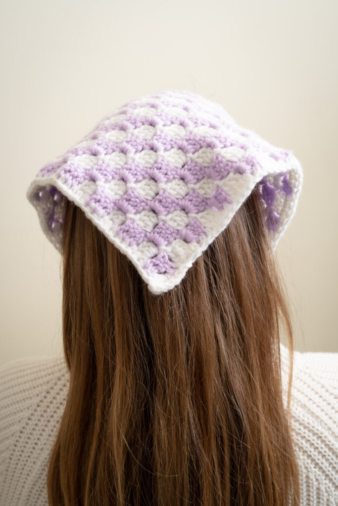 Close-up of stitches in checkered crochet hair scarf pattern